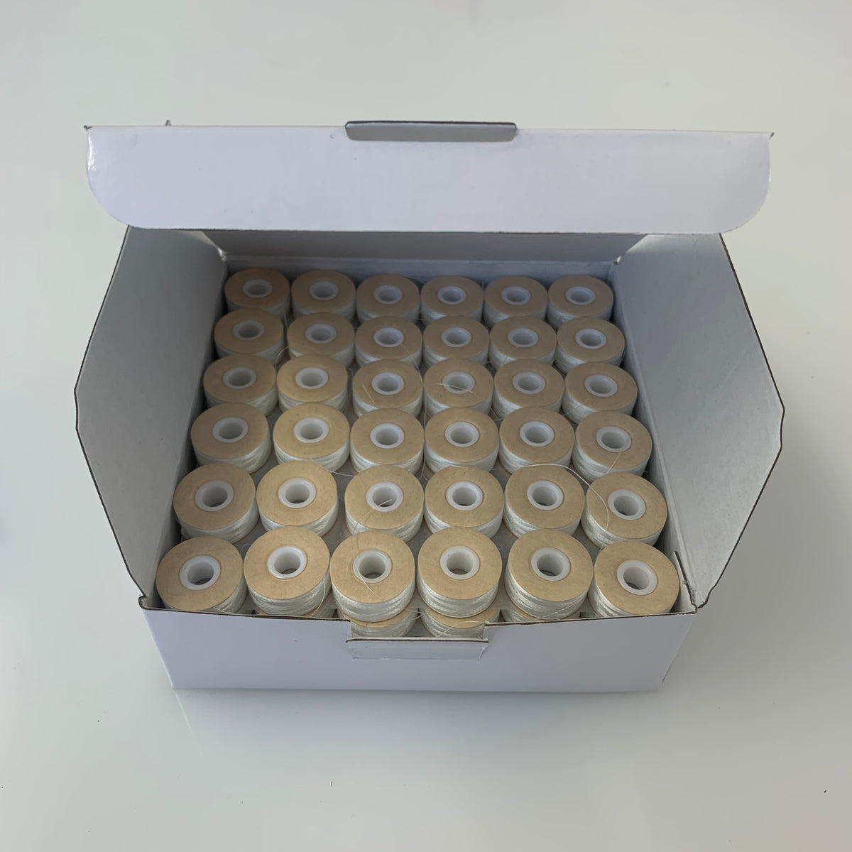 Card sided pre wound Polyester Bobbins